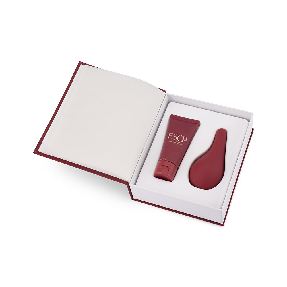 ESCP Luxury Clitoral External Massager inside packaging with lubricant. Designed to sit beside your bed
