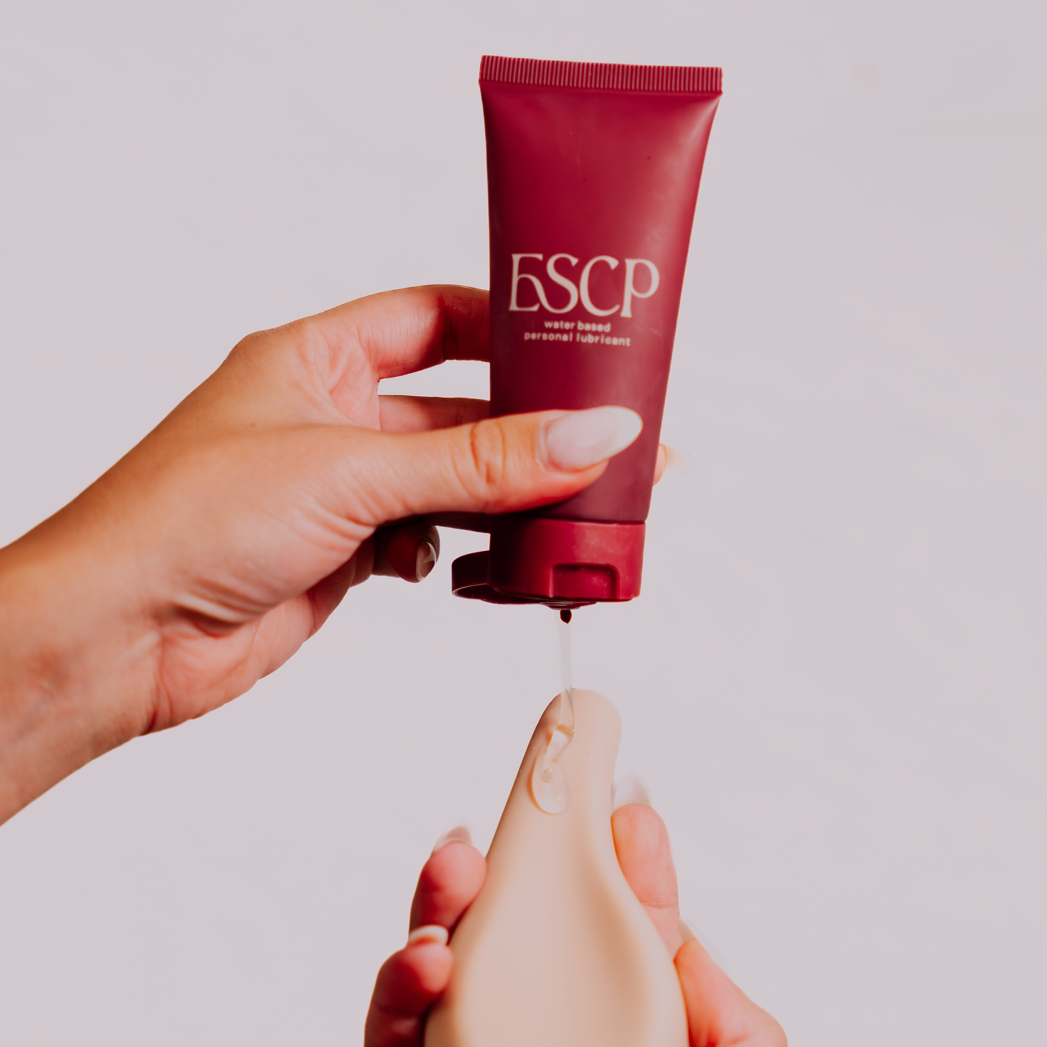ESCP Water Based Personal Lubricant dripping on to Personal Massager