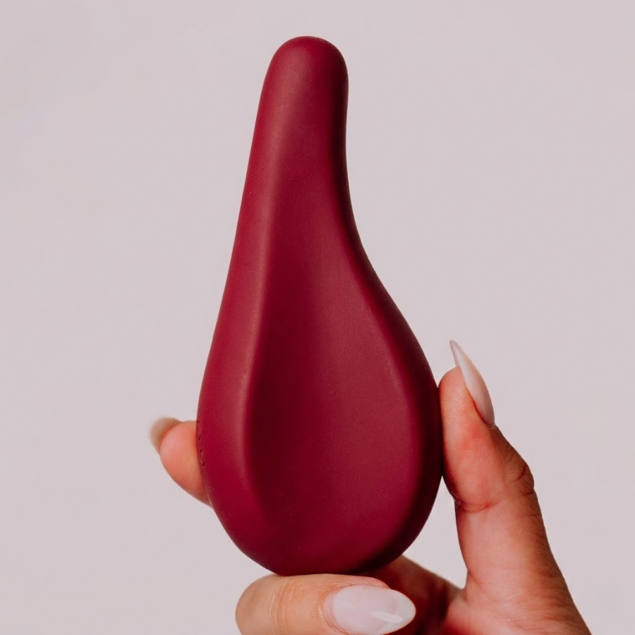 Ergonomic Wellness product in hand in Wine 